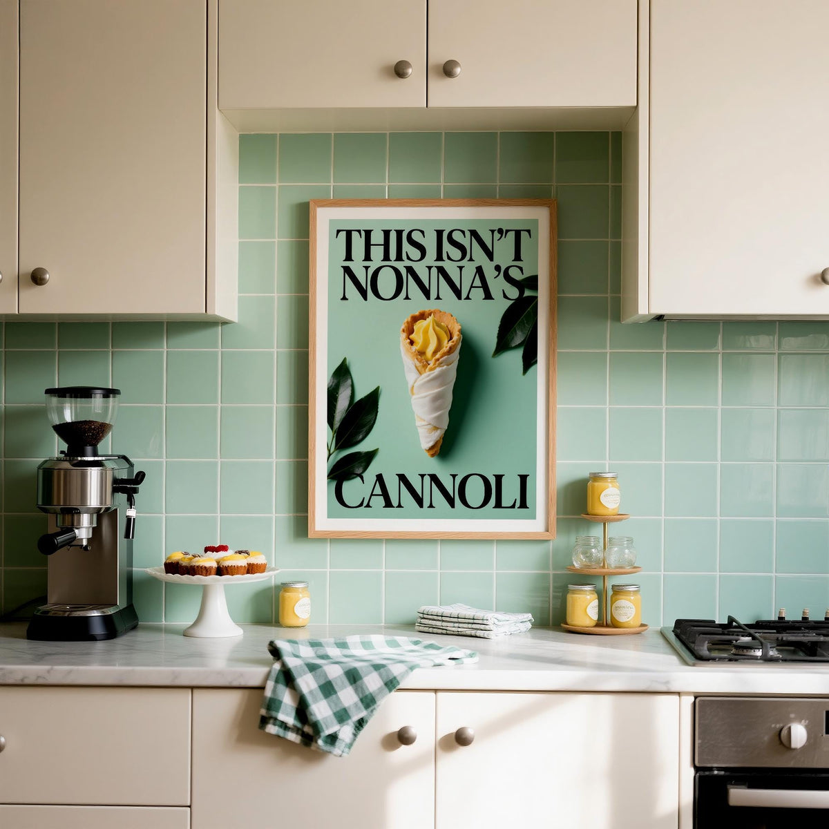 Italian Kitchen Art print on a kitchen wall with pale green tiles and cake stand nearby