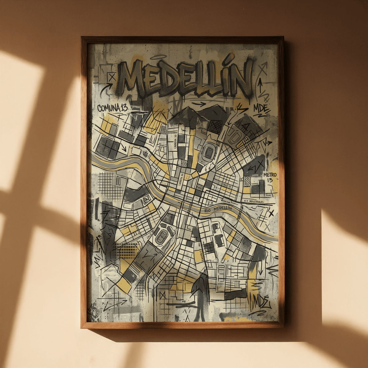 Framed Medellin Map Art Print with yellow grey and black illustration in natural light on a plain wall