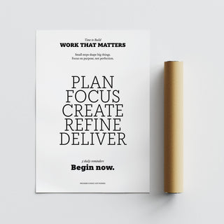 Motivate Quote Poster next to a brown packaging tube on a grey surface