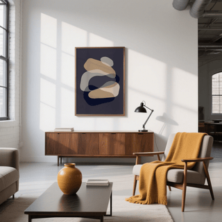 Abstract Art Shapes print with beige and dark blue shapes above a wooden sideboard in a bright living room