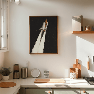 Rocket Launch wall art of a space shuttle with smoke clouds in a kitchen above a counter with plants and utensils