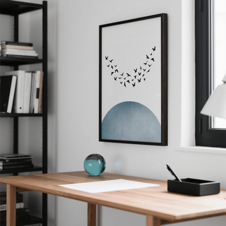 Minimal wall decor with flying birds silhouette and blue semi circle above wooden desk with glass orb
