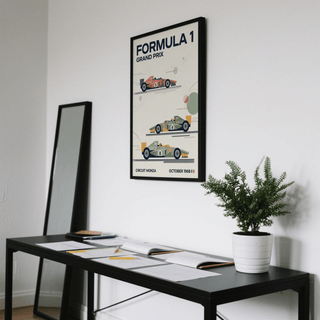 Three Classic Racing Cars Poster in black frame above a black desk with a green plant in white pot