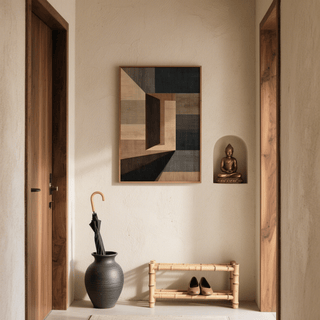 Abstract Geometric wall art with muted browns and greys in a narrow hallway with a Buddha statue and umbrella stand