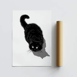 Black Cat Print beside a plain brown packaging tube on a light grey surface