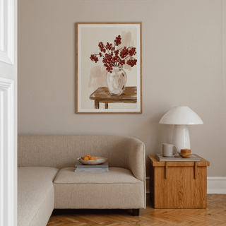 Red Berries Poster print on a wall featuring a watercolour flower vase arrangement above a wooden side table