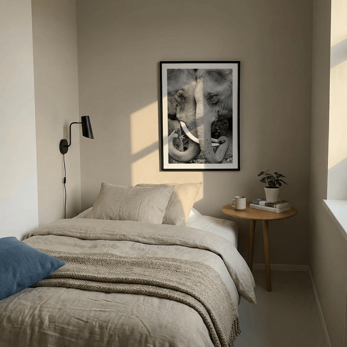 Animal Portrait Art print of two elephants touching trunks in black and white above a beige bed