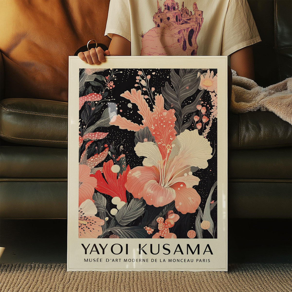 Black and Pink Wall Art held in hands featuring a pink hibiscus flower with black and grey leaves