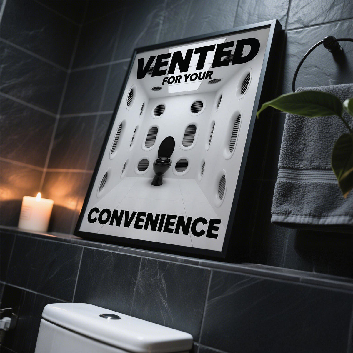 Framed funny toilet sign featuring a black toilet in a white vented room with bold black text on a dark tiled surface next to a candle
