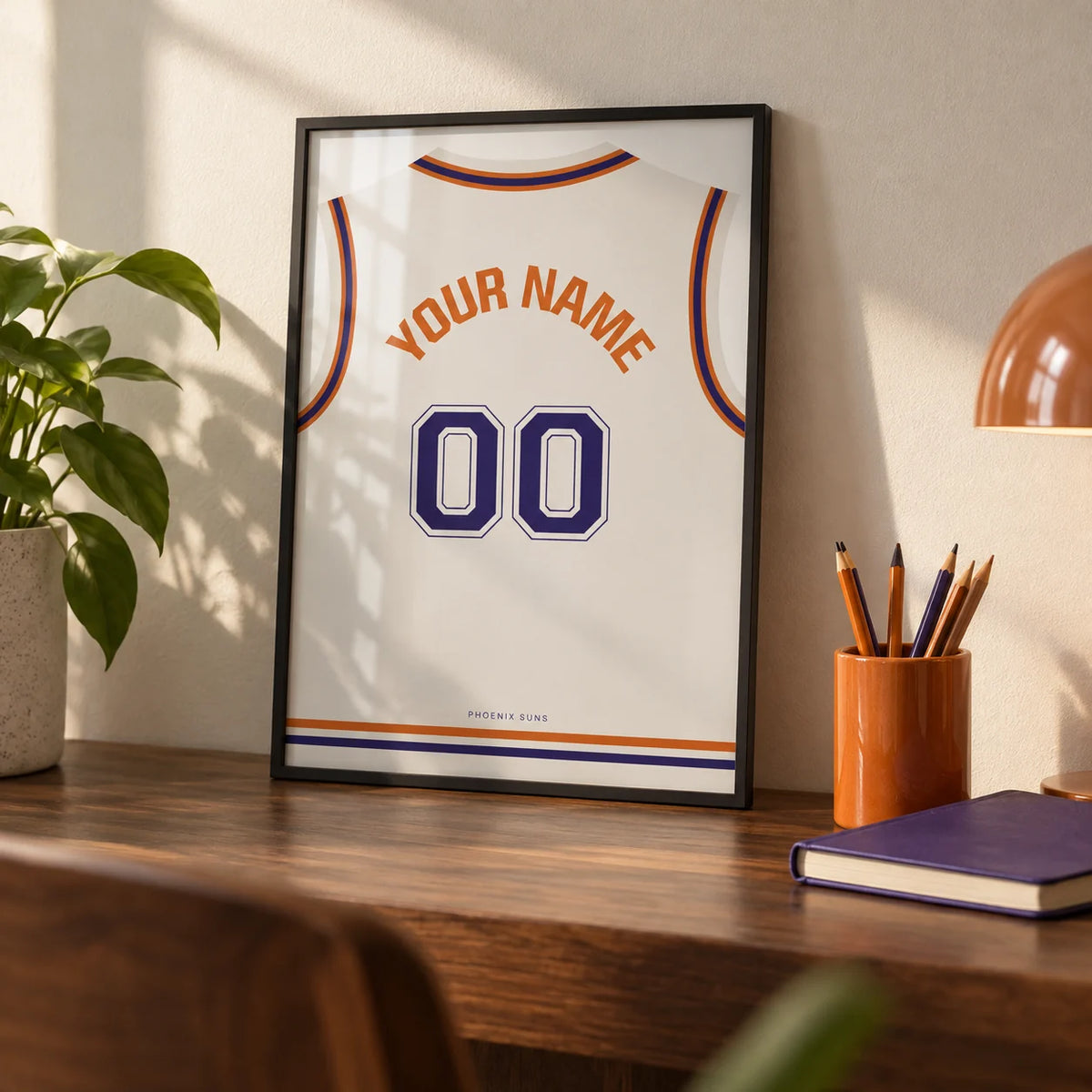 Basketball Jersey Poster in White with Purple Number, a small A4 framed print leaning on a walnut desk