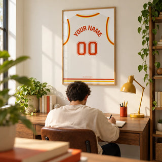 Basketball Jersey Poster in White with Red and Yellow Trim, framed on the wall of a bright home study for a young adult basketball fan (22-35)