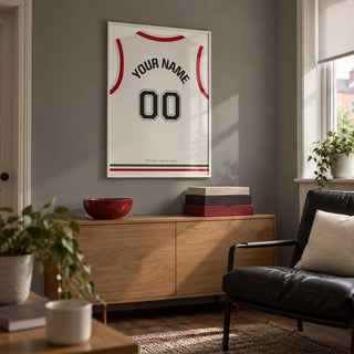 Basketball Jersey Poster in White with Red Sleeves and Black Number, framed on the wall of a small basketball fan's games snug in a UK terrace in a living room