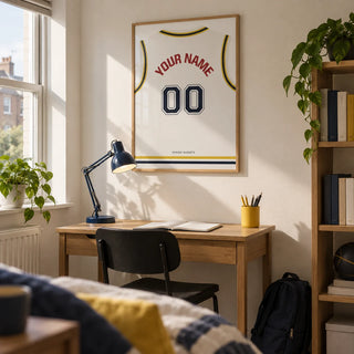 Basketball Jersey Poster in White with Yellow and Navy Trim, framed on the wall of a tidy university study area for a basketball fan (18-21) in a UK shared house with an off-white wall