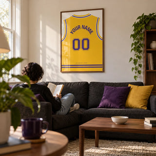 Basketball Jersey Poster in Yellow with Purple Number, framed on the wall of a modern living room in a basketball fan's first UK flat (22-28) with a warm white wall and walnut furniture