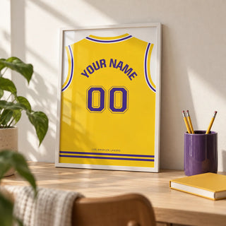 Basketball Jersey Poster in Yellow with Purple Number, a small A4 framed print leaning on a pale oak desk