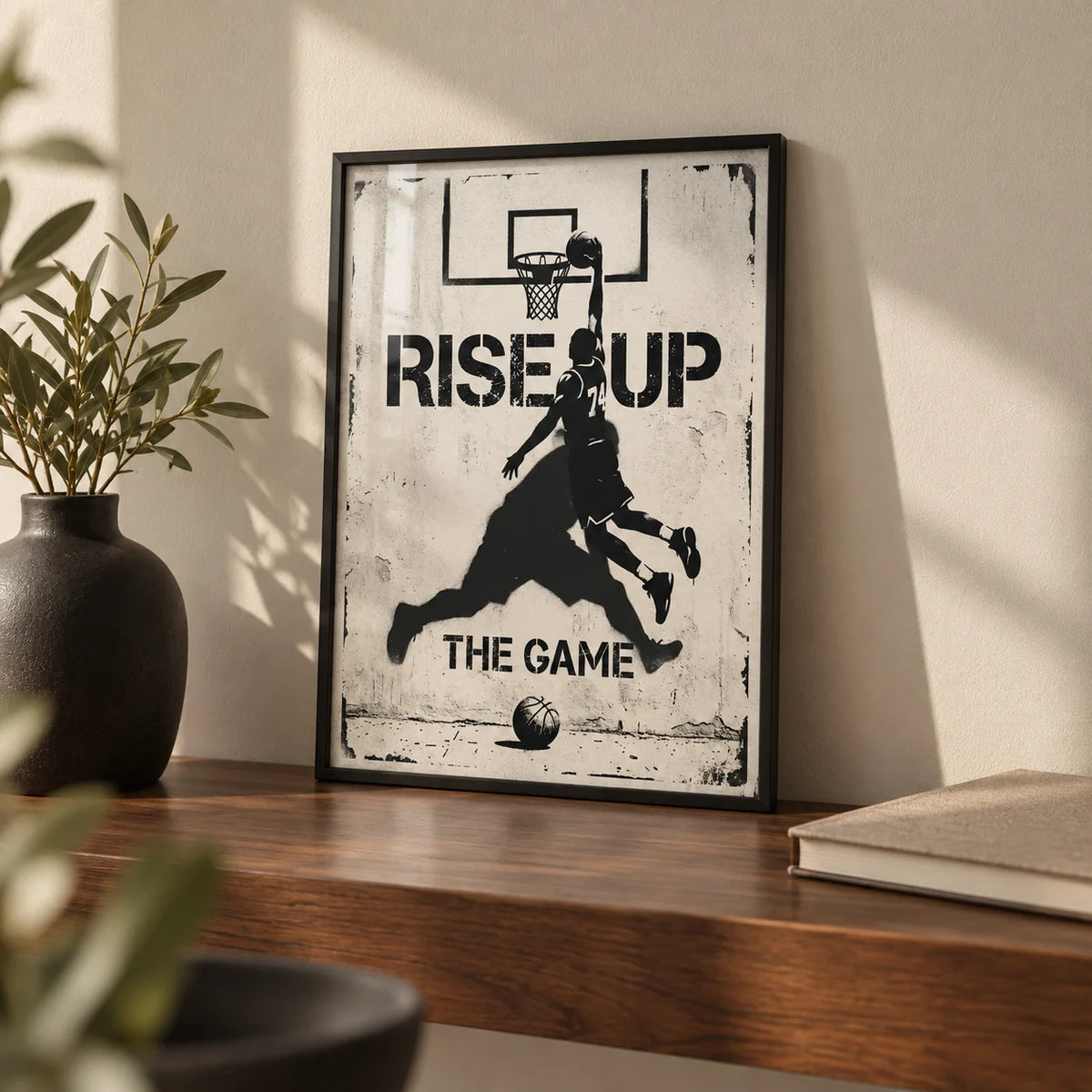 Basketball Rise Up Art Print, a small A4 framed print leaning on a walnut shelf in a living room