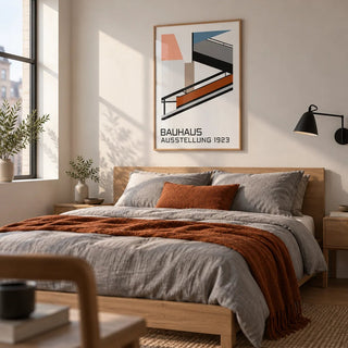Bauhaus Exhibition Poster 1923, framed on the wall of a crisp modern bedroom in a city flat