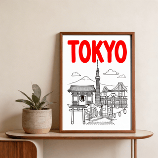 Framed Tokyo City wall art with red lettering and black line-art landmarks on a wooden table with a plant