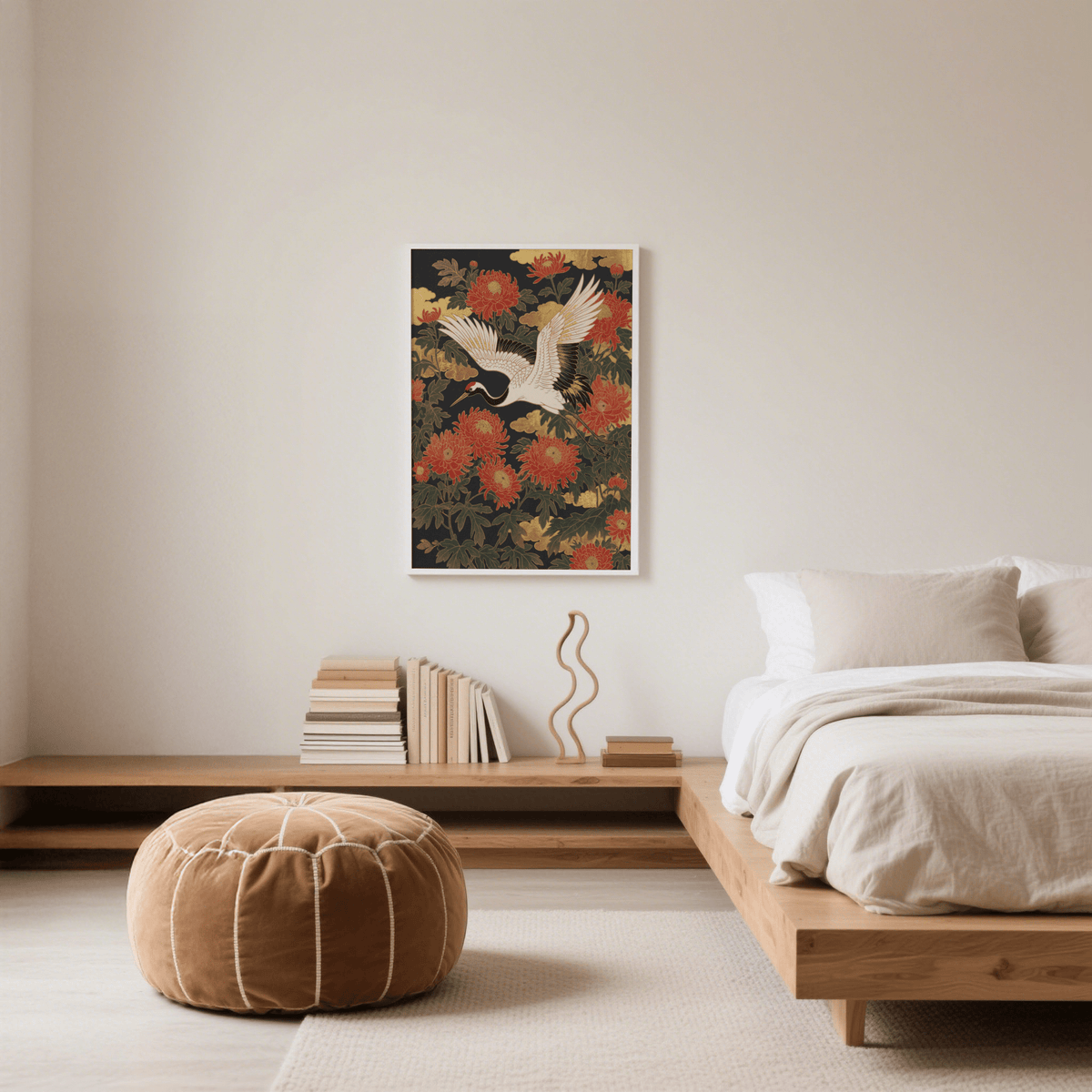 Crane Floral Art Print on a bedroom wall with red flowers and gold cloud details above wooden shelf and beige pouffe