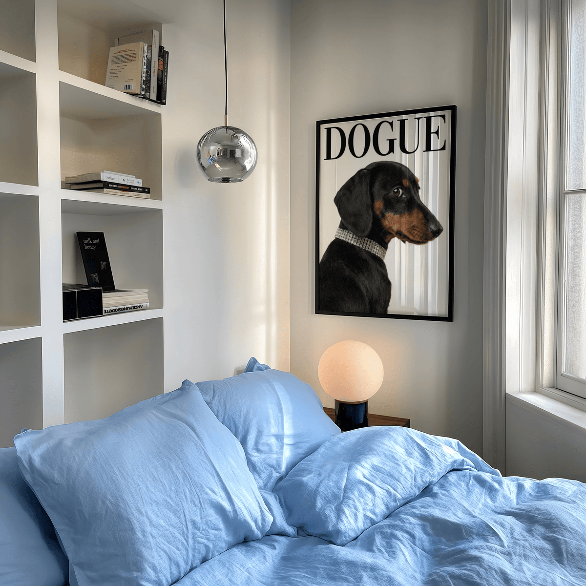 Dachshund art print of a black and tan dog with a collar on a bedroom wall above a spherical lamp