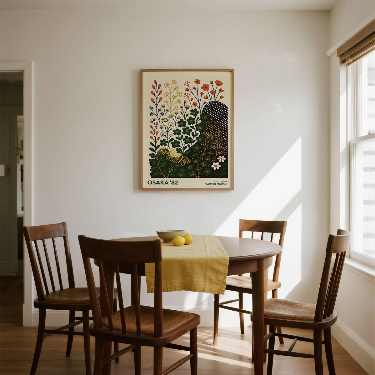 Modern Nature wall art print of clover flowers in green, yellow and orange above a dining table