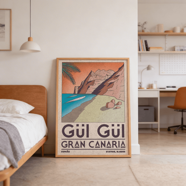 Gran Canaria beach art print leaning on the floor beside a bed in a bedroom with neutral tones