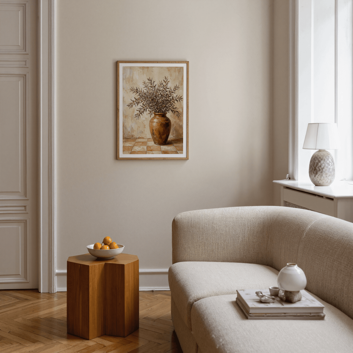Print of Rustic Olive Art with olive branches in a vase on a beige wall above a side table with a bowl
