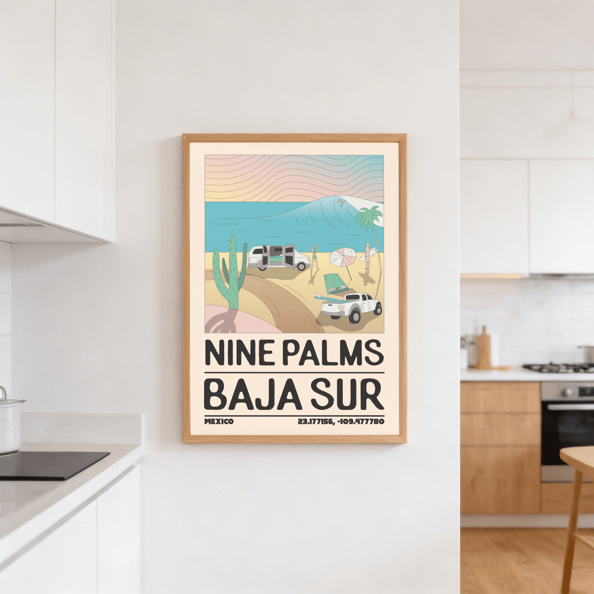 Baja Sur wall art of a minimalist beach scene with waves framed on a white kitchen wall near a stove