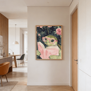 Turtle Reading Art Print hung on a beige wall in a room with wooden door and furniture