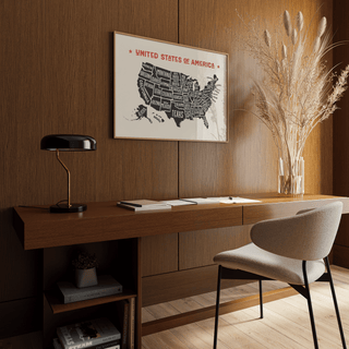 Us Map Poster hung above a wooden desk with a black lamp and a beige chair in a brown paneled room