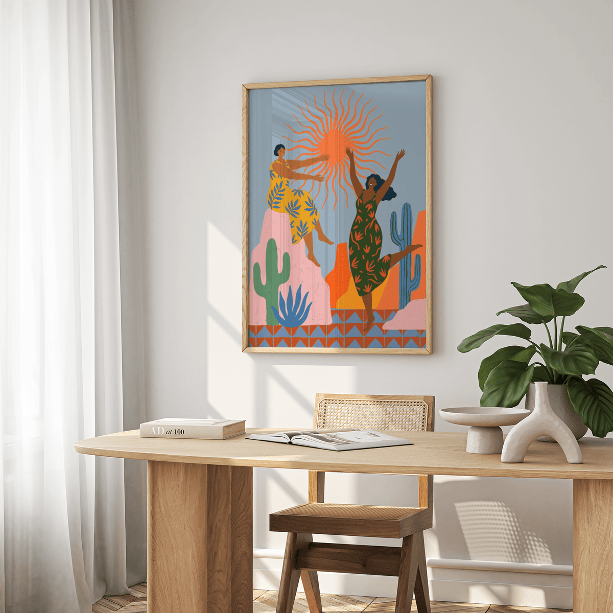 Sunset Women Art Print in a dining room with a plant on the table and natural light
