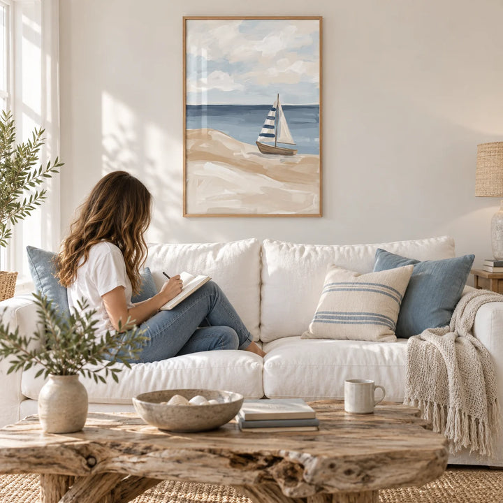 Beach Sailboat Wall Art, framed on the wall of a light coastal living room