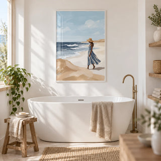 Beach Woman Art Print, framed on the wall of a bright coastal bathroom with white walls
