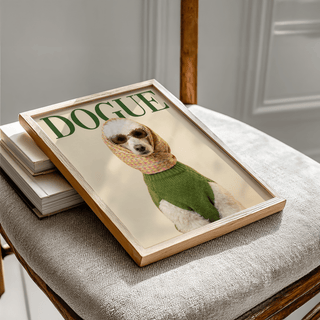 Framed Fashion Poodle wall art of a white poodle wearing sunglasses and a green sweater on a chair