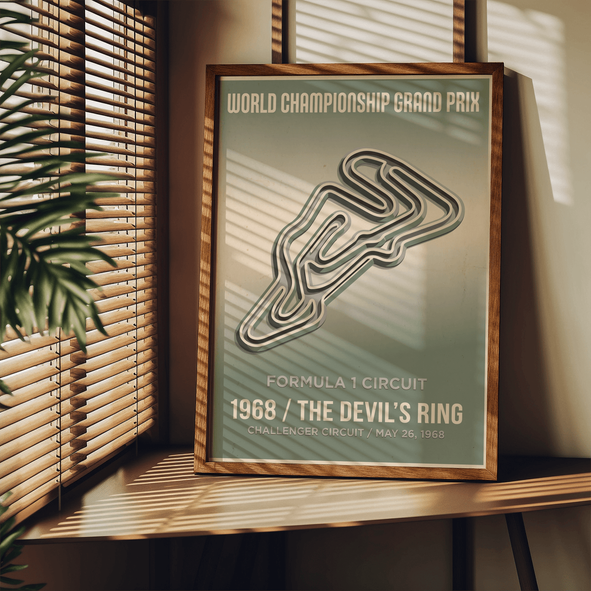 Framed vintage street circuit map poster in green and cream leaning on a shelf with sunlight and plant nearby
