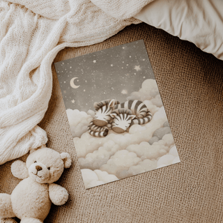 Zebra Nursery Art print of sleeping baby zebras on clouds with stars and moon near a teddy on carpet