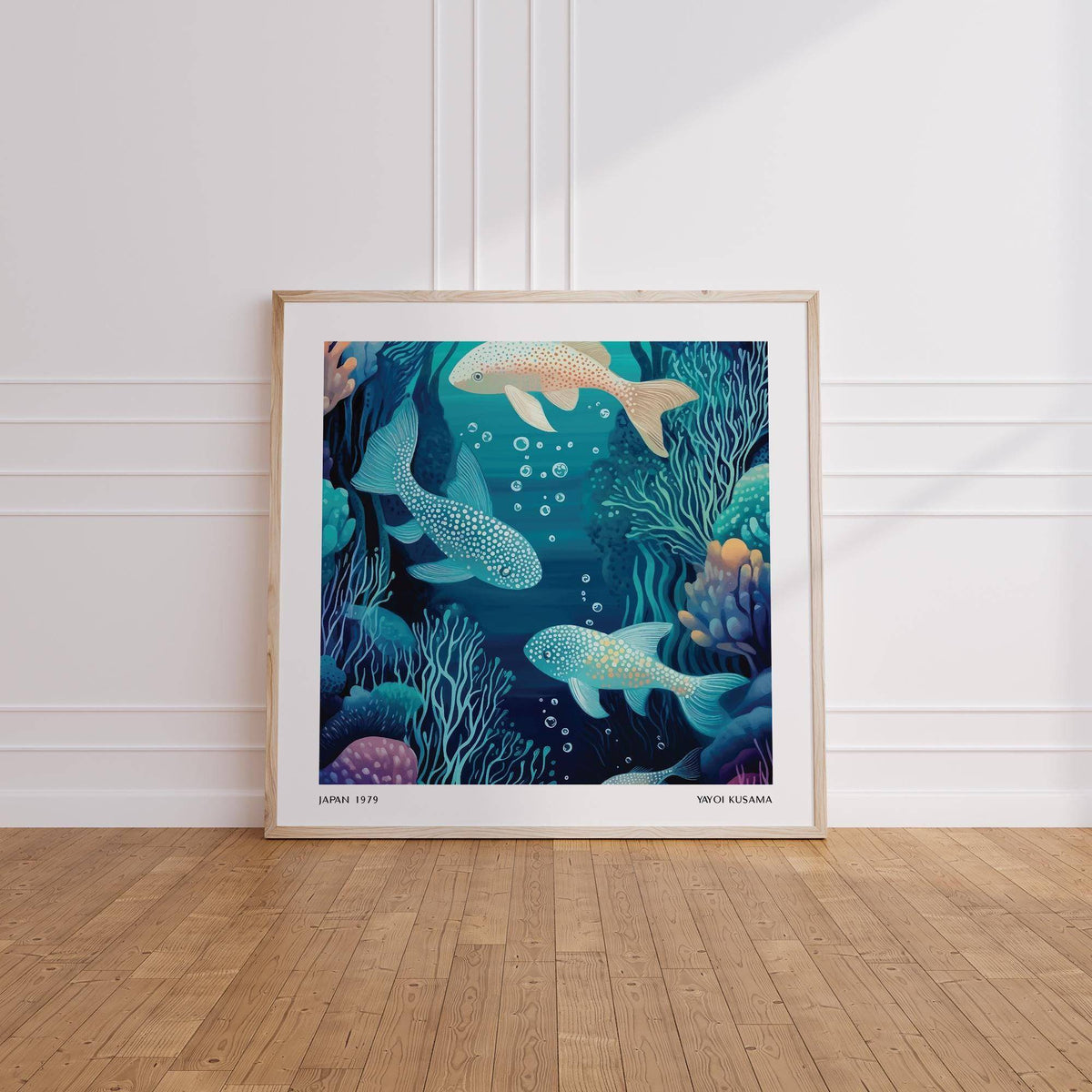 Wall Art Fish print leaning on a wooden floor with a white wall behind showing spotted fish in blues and greens