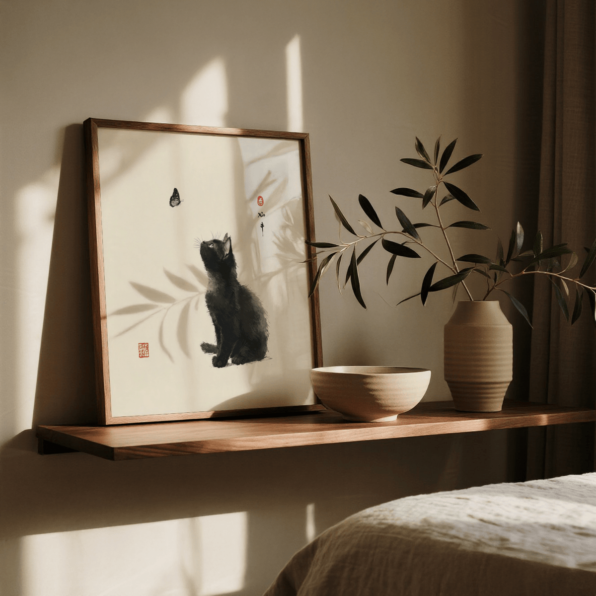 Print leaning on a shelf of a black cat with a butterfly in Japanese ink style next to a bowl and plant vase