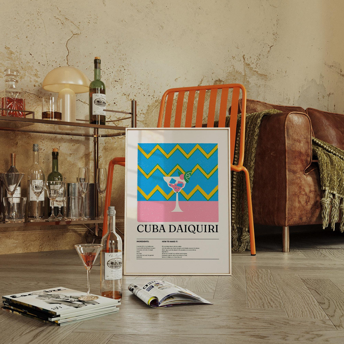 Print leaning on floor of pop-art daiquiri cocktail with blue and yellow zigzags near an orange chair in a living room