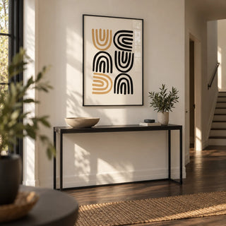 Black and Gold Pictures, framed on the wall of a calm hallway with an off-white wall and a dark wood floor
