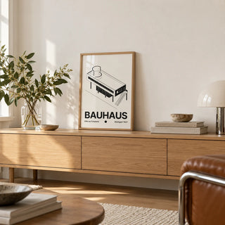 Black and White Architecture Poster, a small A4 framed print leaning on a low pale wooden side table in a hallway