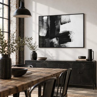 Black and White Art Print, framed on the wall of a industrial dining room with a white wall