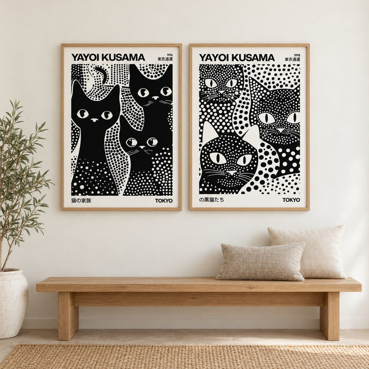 Black and White Cat Prints Set of 2 hung at eye level above an oak bench in a hallway: 3 Black Cats and Kusama Black Cats shown framed side by side (frames not included)