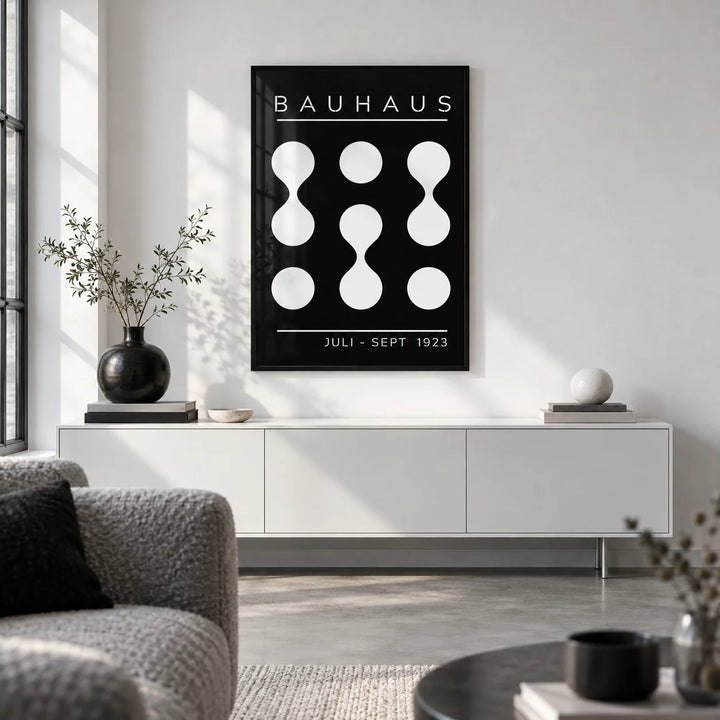 Black and White Geometric Art, framed on the wall of a monochrome city-flat living room with a white wall and polished concrete
