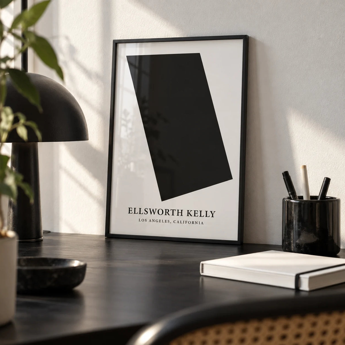Black and White Office Wall Art, a small A4 framed print leaning on a black desk