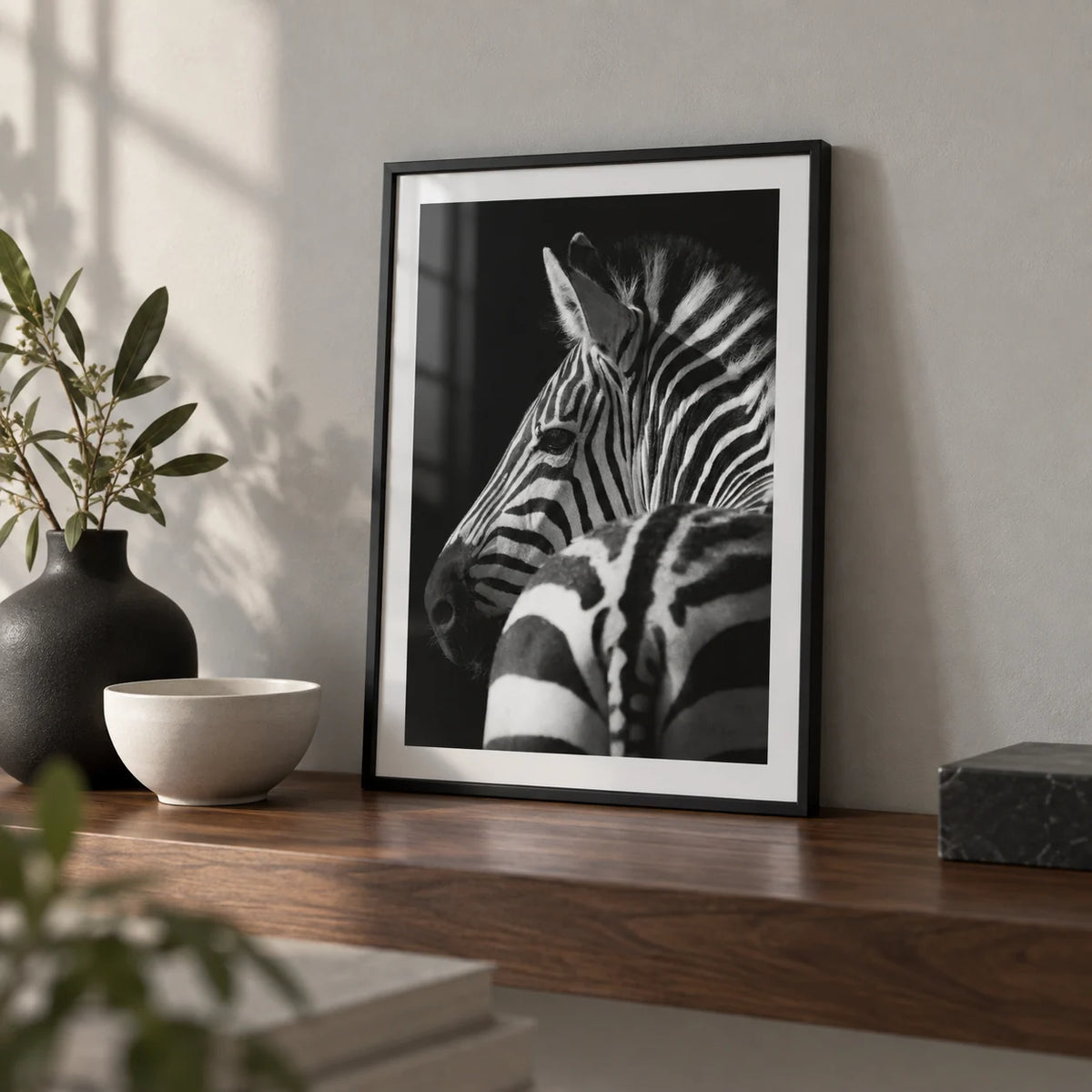 Black And White Zebra Print, a small A4 framed print leaning on a walnut shelf in a living room