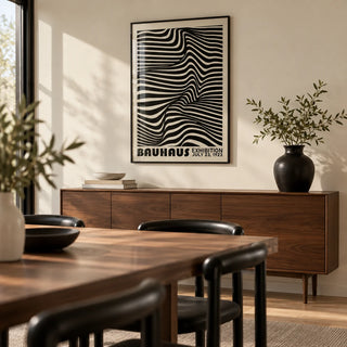 Black Minimalist Wall Art, framed on the wall of a modern dining room with a cream wall