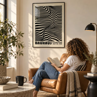 Black Minimalist Wall Art, framed on the wall of a modern reading spot with a cream wall in a living room