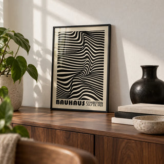 Black Minimalist Wall Art, a small A4 framed print leaning on a walnut shelf in a living room