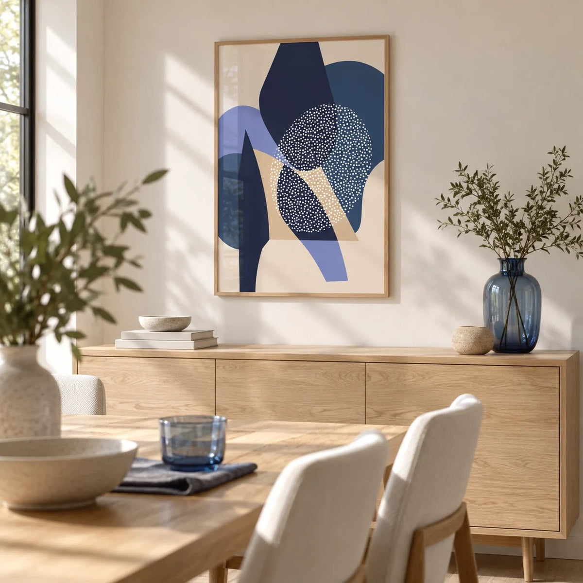 Blue Abstract Print, framed on the wall of a bright dining room
